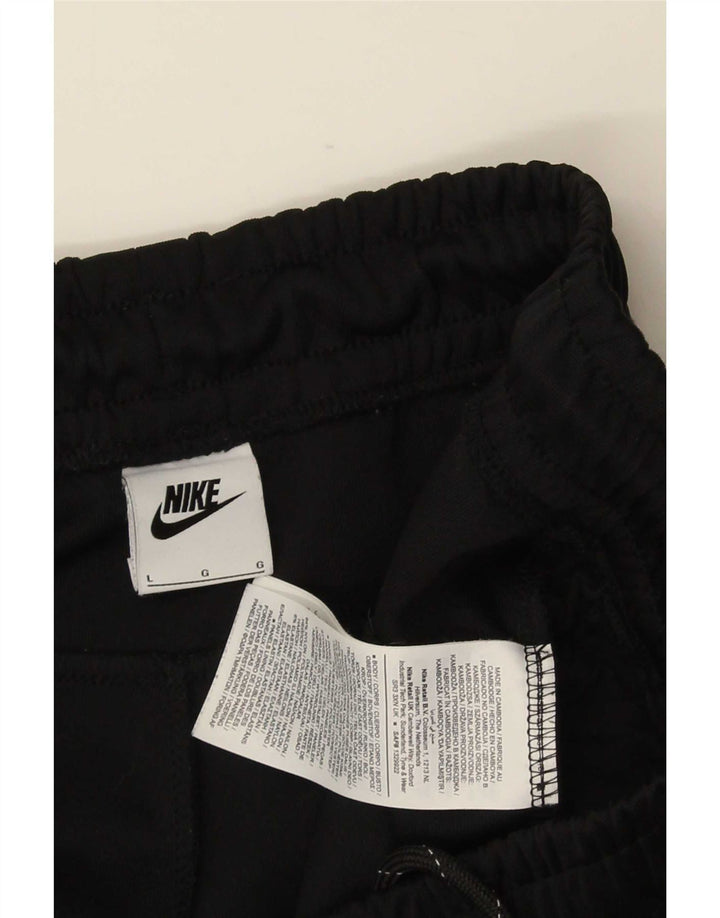 Męskie spodnie dresowe Nike z grafiką, duże czarne bloki kolorów