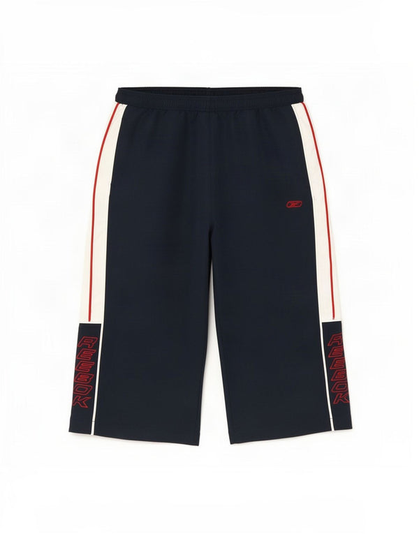 Chłopięce spodnie wiatrówkowe Reebok z grafiką 15-16 lat XL, granatowe