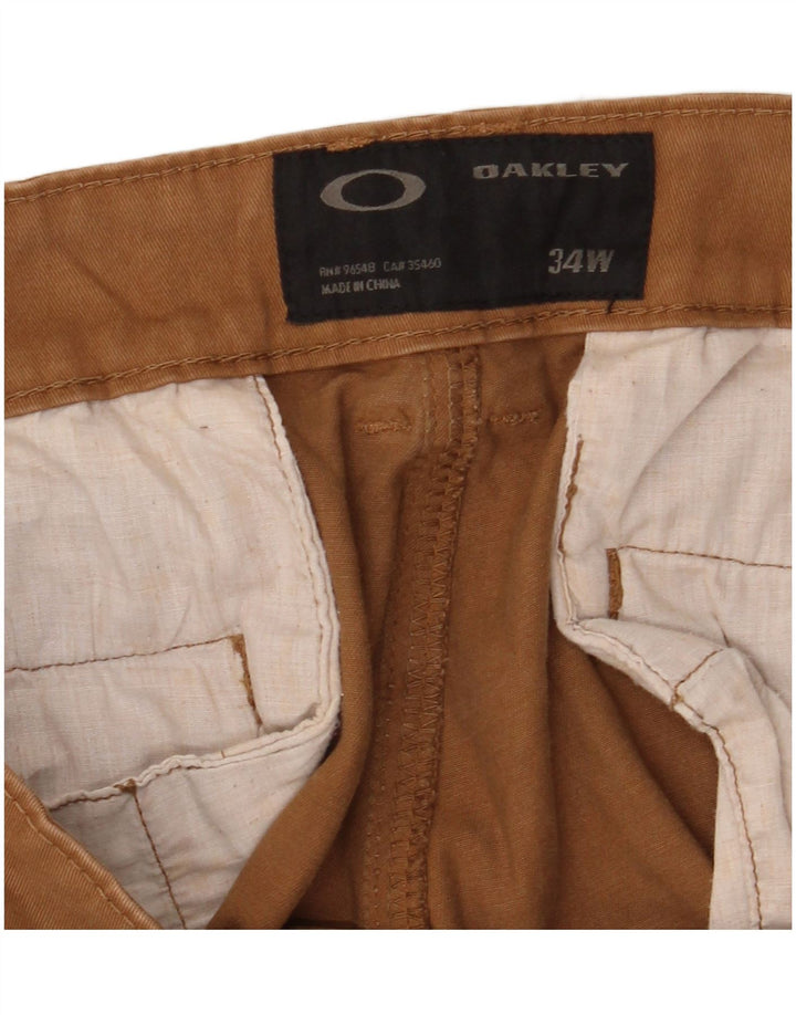 Męskie proste spodnie chino Oakley W34 L33 brązowe