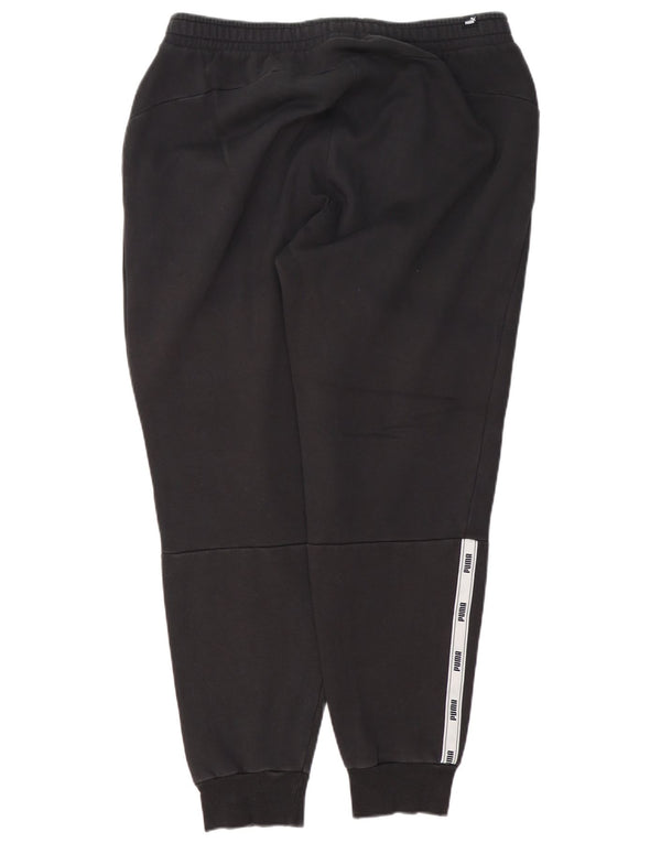 Męskie spodnie dresowe Puma Graphic Joggers XL Czarne, bawełniane, z blokami kolorów