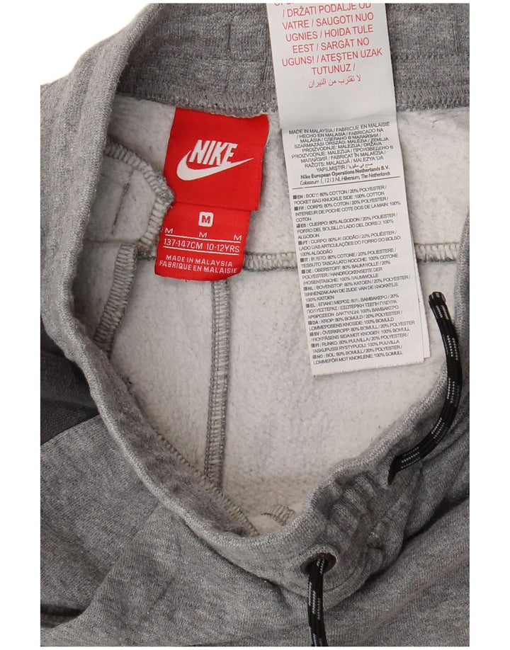 Spodnie chłopięce Nike Dresowe Joggery 10-11 lat, średnia szara bawełna