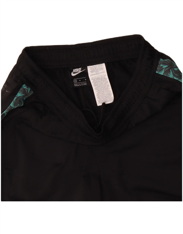 Męskie spodnie dresowe NIKE z grafiką, poliester w kolorze średniej czerni, w blokach kolorystycznych