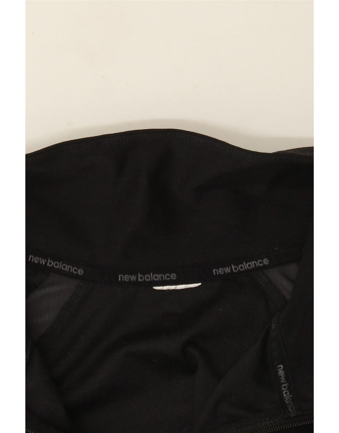 Damski dres New Balance z zamkiem błyskawicznym, UK 14, średni czarny