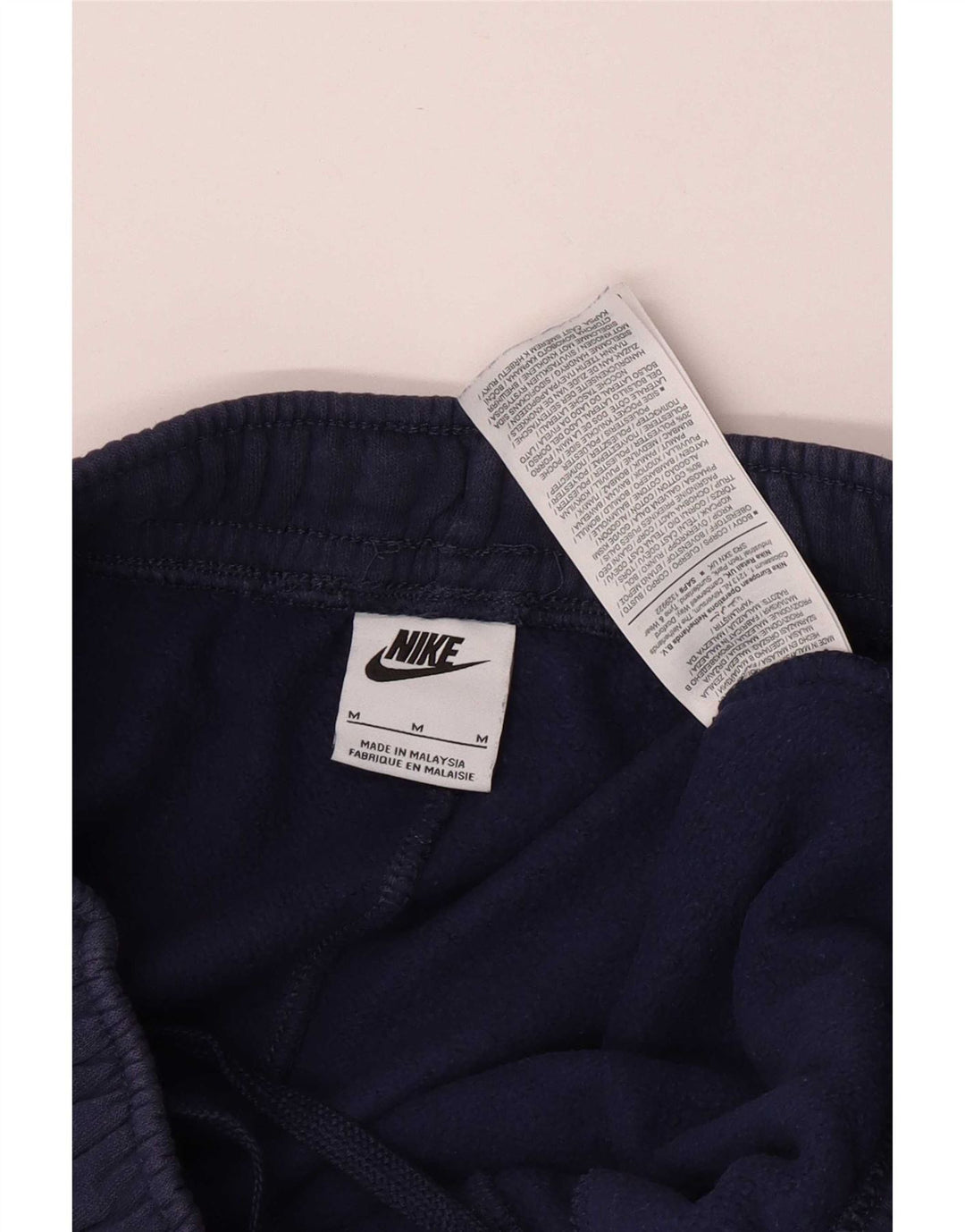 Męskie spodnie dresowe Nike Cargo Joggers, średni granatowy, bawełniany