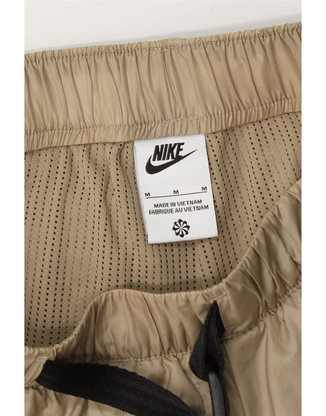 Męskie spodnie dresowe Nike Cargo Joggers, średni beżowy poliester