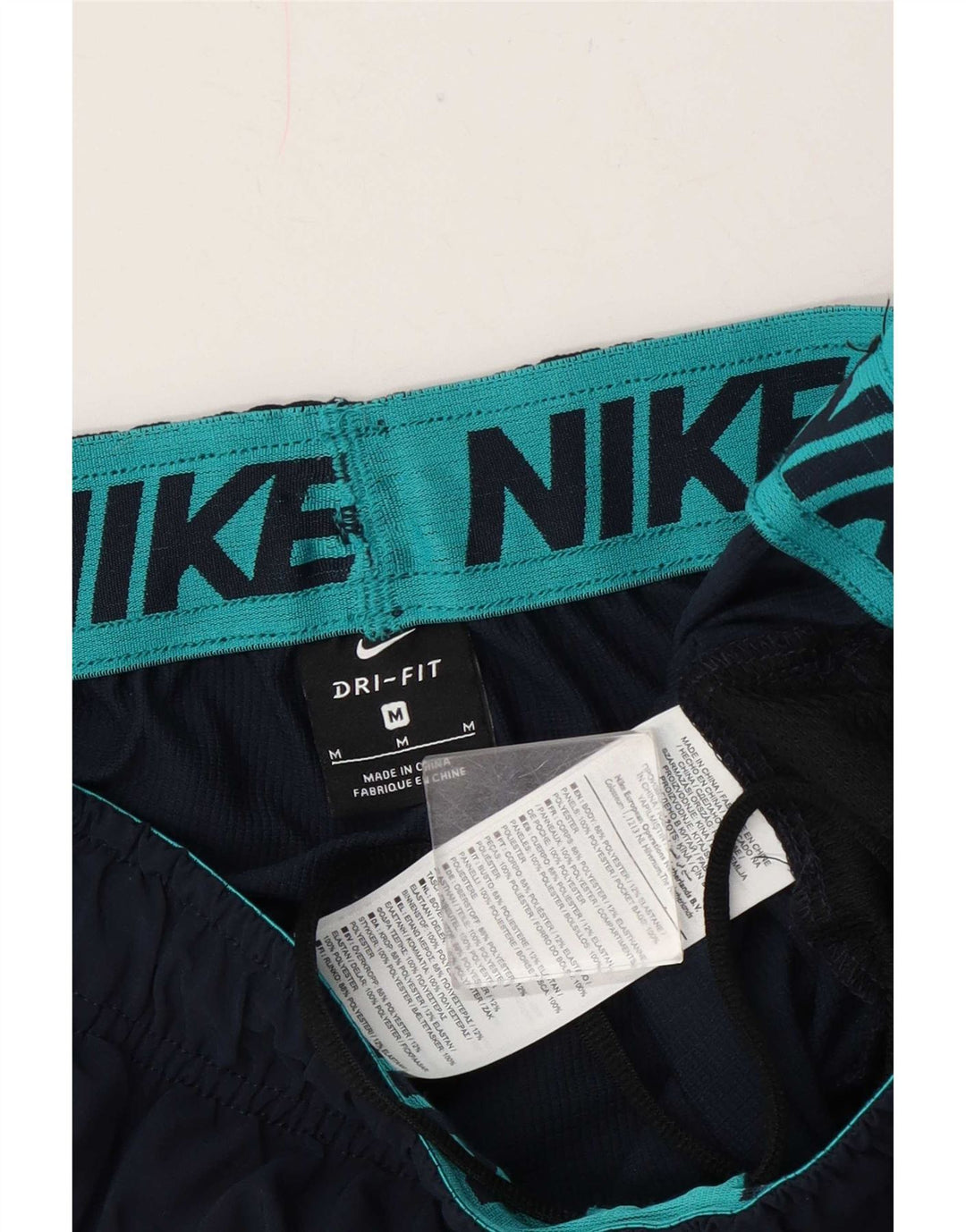 Męskie spodnie dresowe Nike Graphic Joggers, średni granatowy poliester