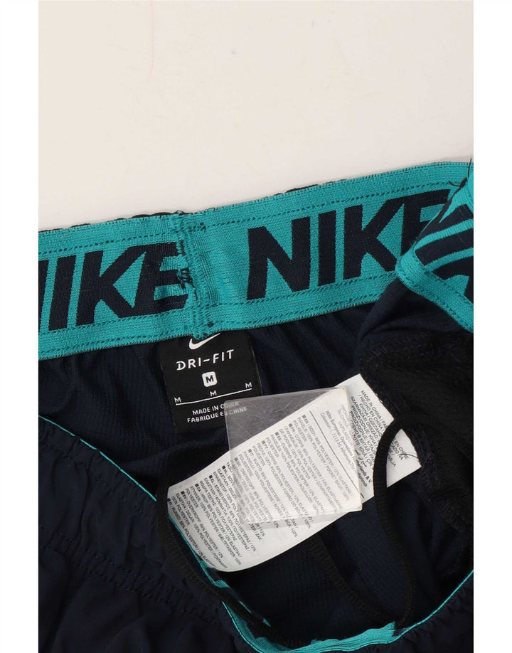 Męskie spodnie dresowe Nike Graphic Joggers, średni granatowy poliester