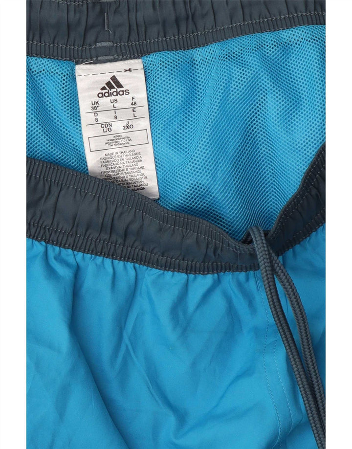 Męskie spodenki sportowe Adidas z grafiką, duże, niebieskie, z blokami kolorów, z poliestru