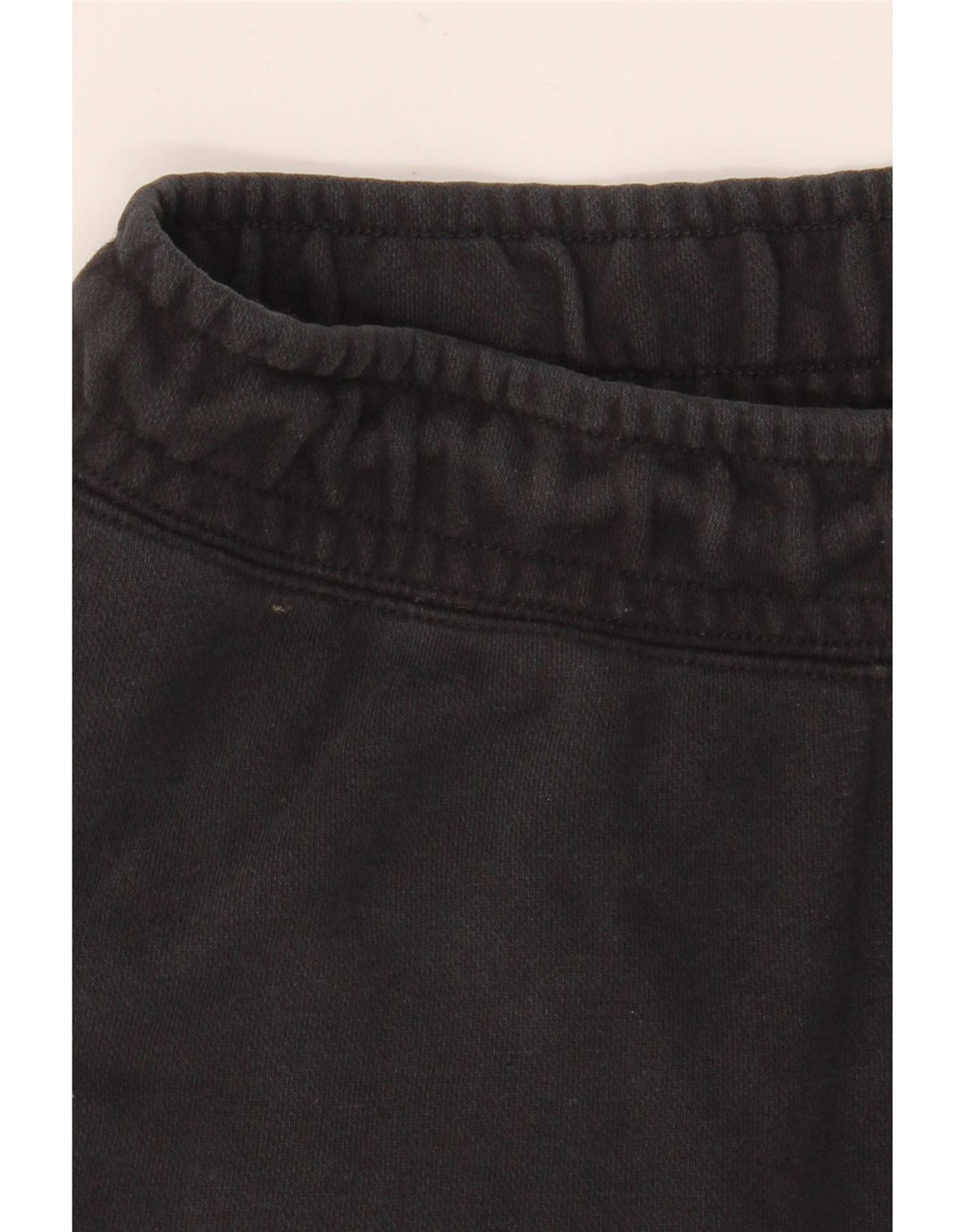 Męskie spodnie dresowe Nike Graphic Joggers, średnia czarna bawełna