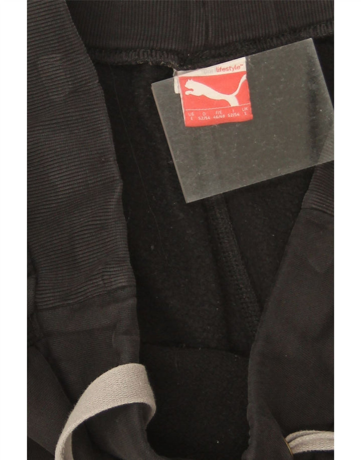 Męskie spodnie dresowe Puma Graphic, duże, czarne