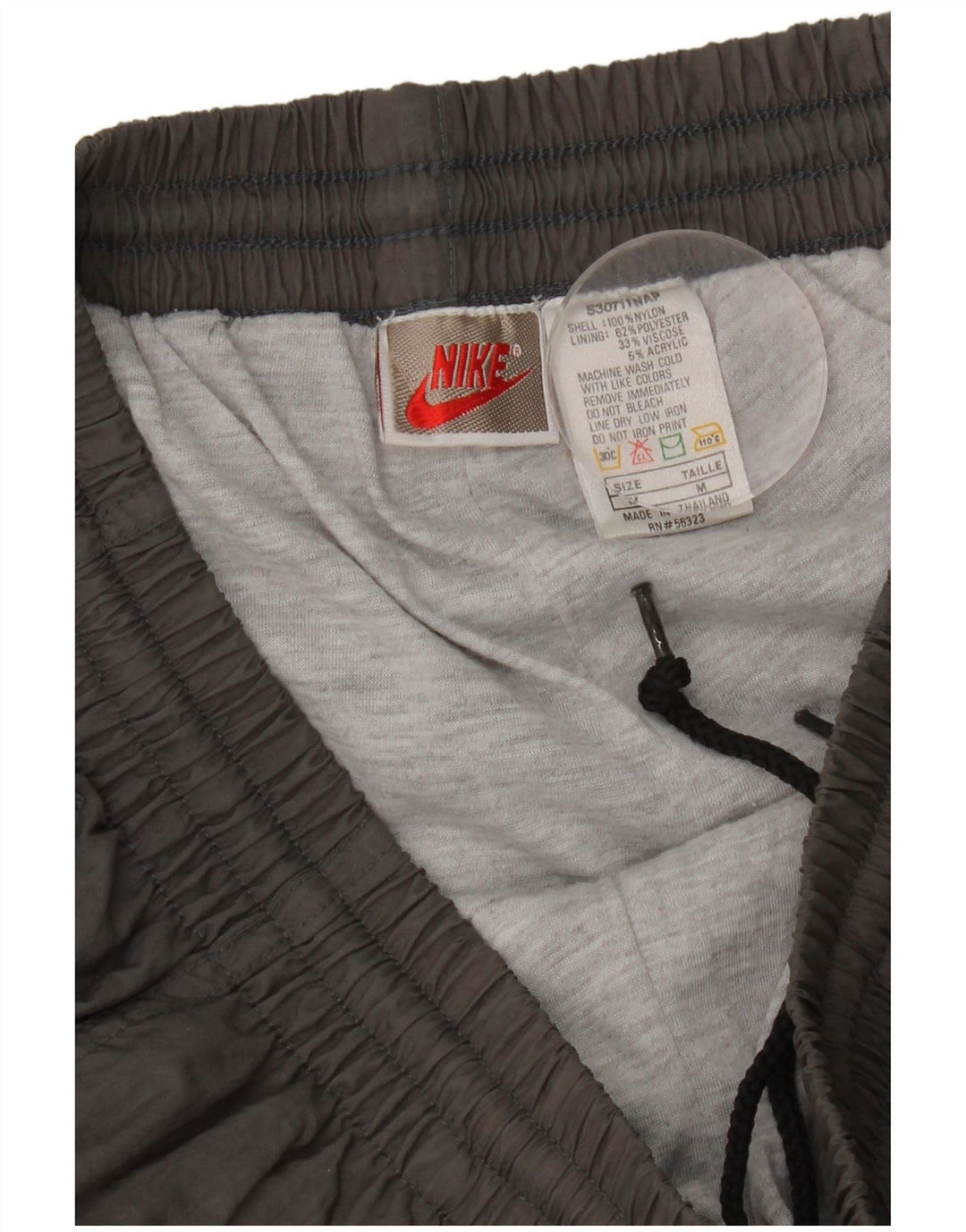Męskie spodnie dresowe Nike, średnioszare, nylonowe