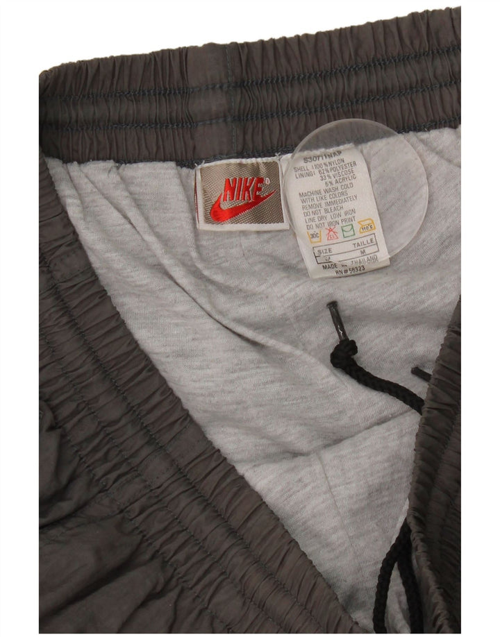 Męskie spodnie dresowe Nike, średnioszare, nylonowe