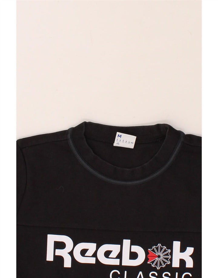 REEBOK Womens Classic Graphic Sweatshirt Jumper UK 12/14 Medium Black Vintage Reebok and Second-Hand Reebok from Messina Hembry 