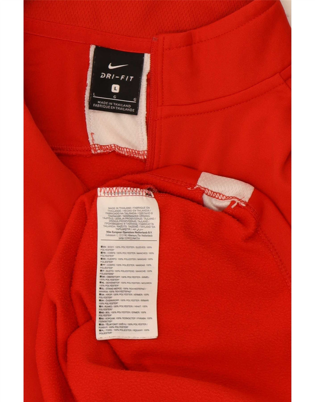 Męski dres Nike Dri Fit z zamkiem błyskawicznym i dużym czerwonym blokiem kolorów