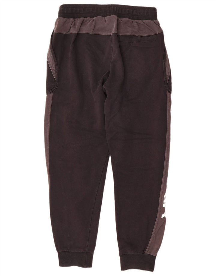 Męskie spodnie dresowe Nike Graphic Tracksuit Joggers w kolorze średniej czerni