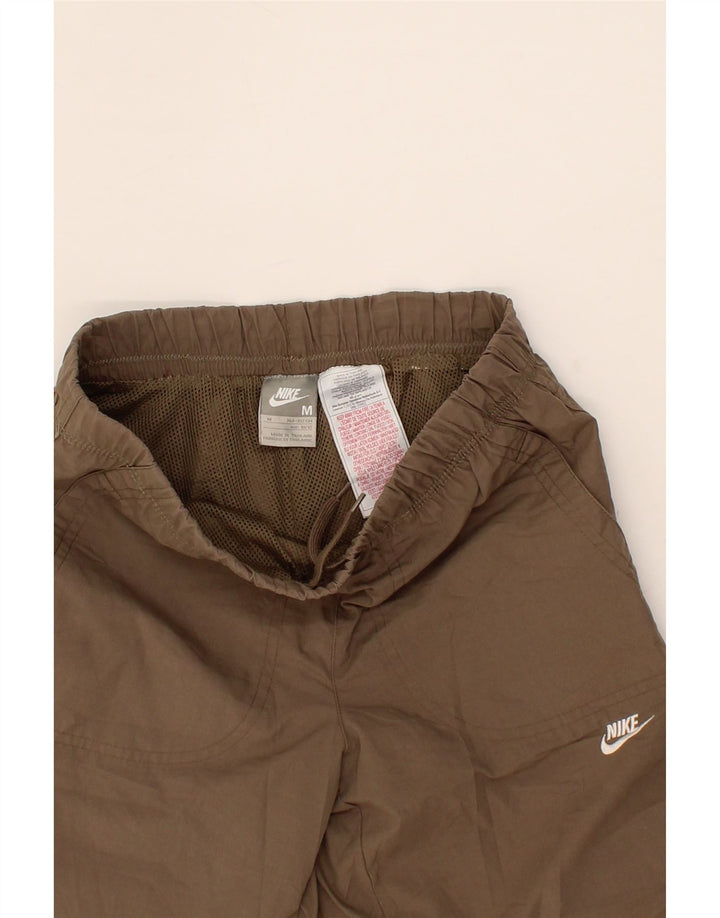 NIKE Boys Capri Tracksuit Trousers 10-11 Years Medium Brown Polyester Vintage Nike and Second-Hand Nike from Messina Hembry 