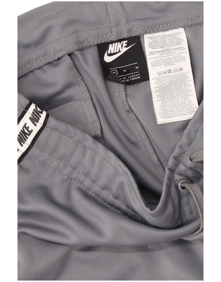 Męskie spodnie dresowe Nike Graphic Dresy Joggery w kolorze średnioszarym