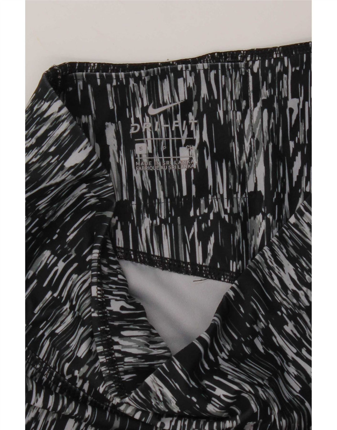 Damskie legginsy Nike Dri Fit Abstrakcyjny wzór Capri UK 10 Małe czarne