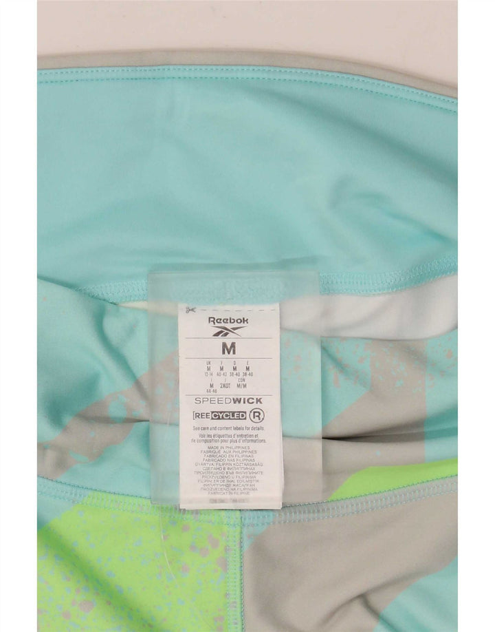 Damskie legginsy Reebok Capri UK 12/14 Średni turkusowy geometryczny poliester