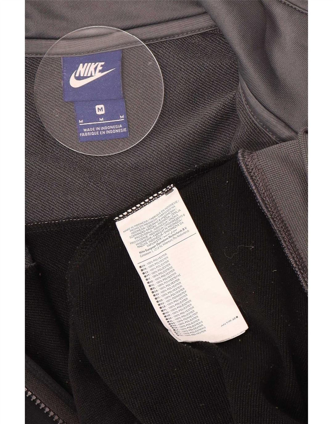 Męska kurtka dresowa Nike, średnia czarna, poliestrowa z blokami kolorów