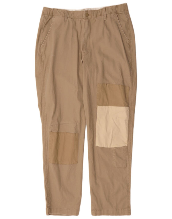 Męskie zwężane spodnie chino Levi's, duże W34 L30, beżowa bawełna z blokami kolorów