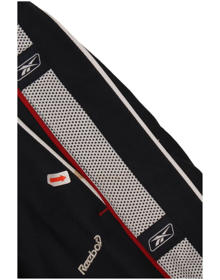 Chłopięce spodnie dresowe Reebok z grafiką 14-15 lat XL, granatowe, z blokami kolorów