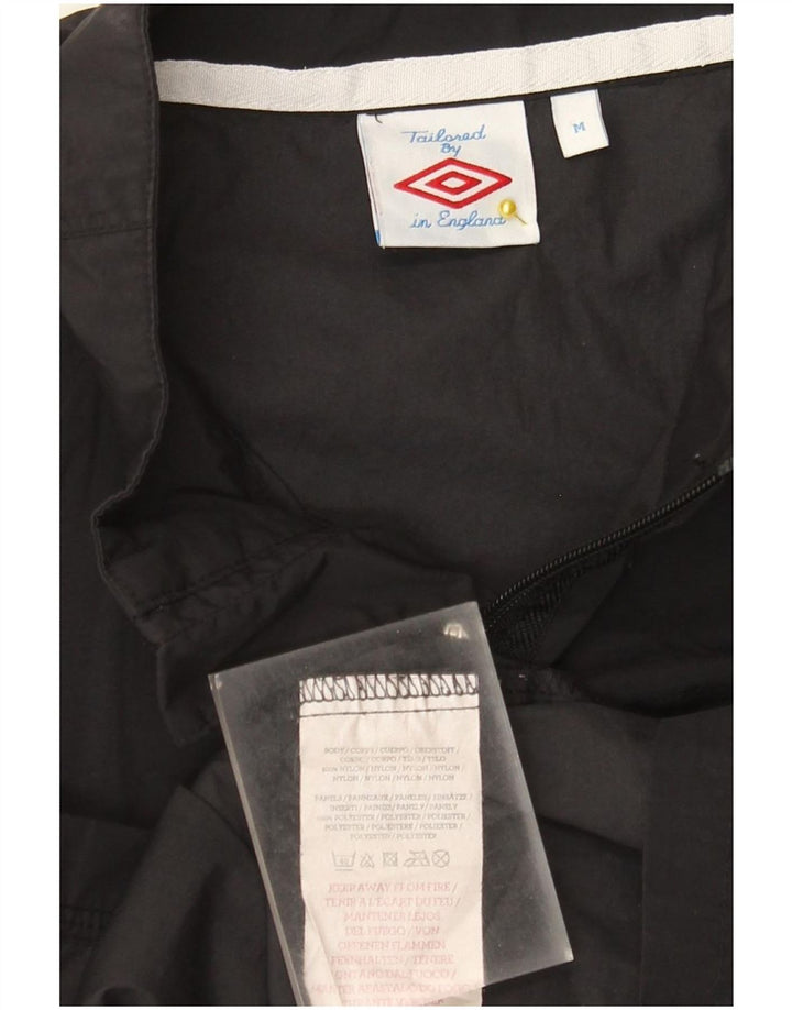 Damska kurtka przeciwdeszczowa Umbro z grafiką UK 14, średni czarny nylon