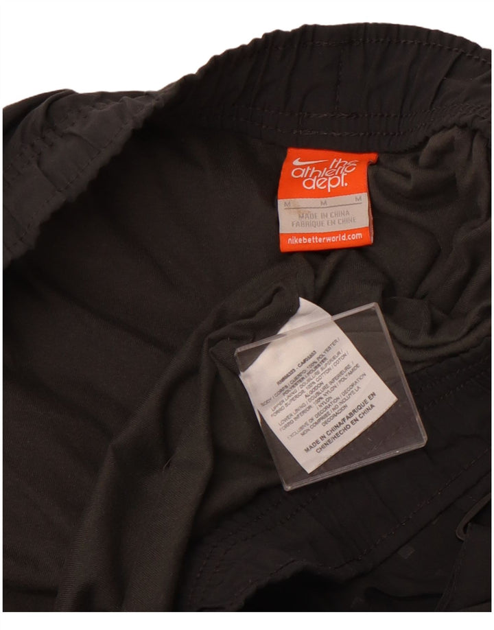 Męskie spodnie dresowe NIKE Joggery w kolorze średnioszarym, z poliestru