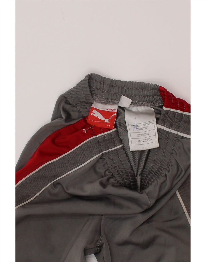 Chłopięce spodnie dresowe Puma 4-5 lat Szary poliester z blokami kolorów