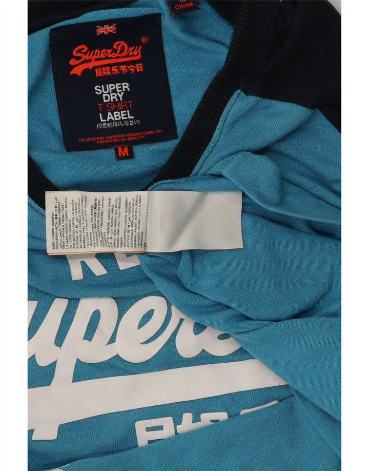 Męski top Superdry z grafiką, długim rękawem, bawełniany w kolorze średniego błękitu