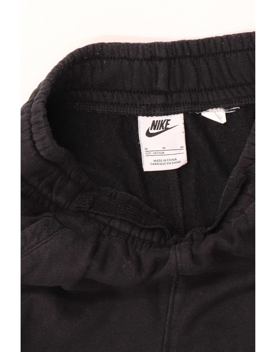 Chłopięce spodnie dresowe Nike z grafiką, 10-11 lat, średnie czarne