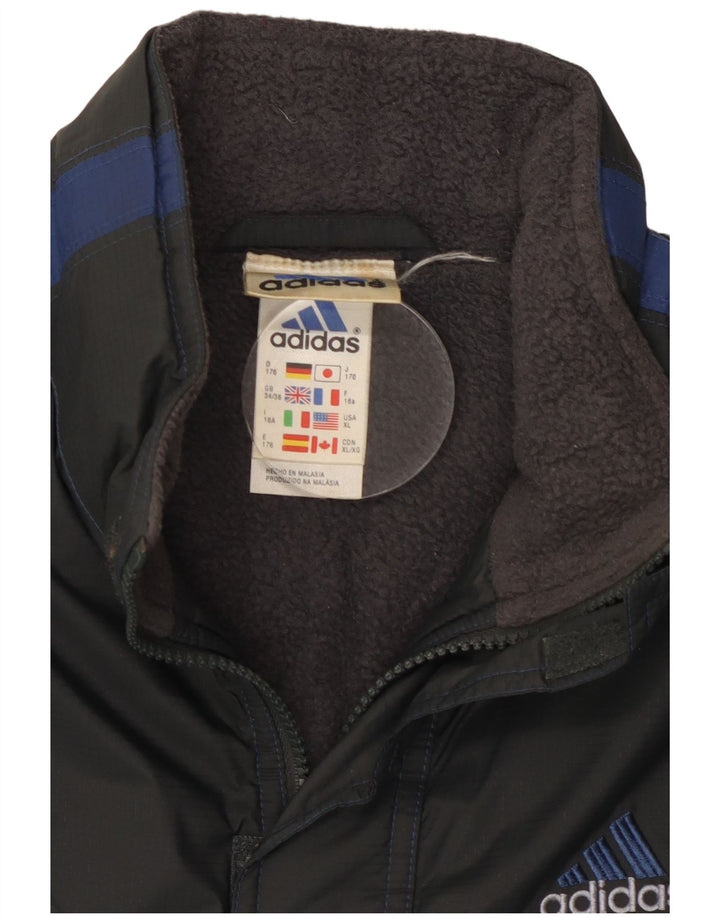 Chłopięca kurtka wiatrówka Adidas 15-16 lat Czarny poliester z blokami kolorów