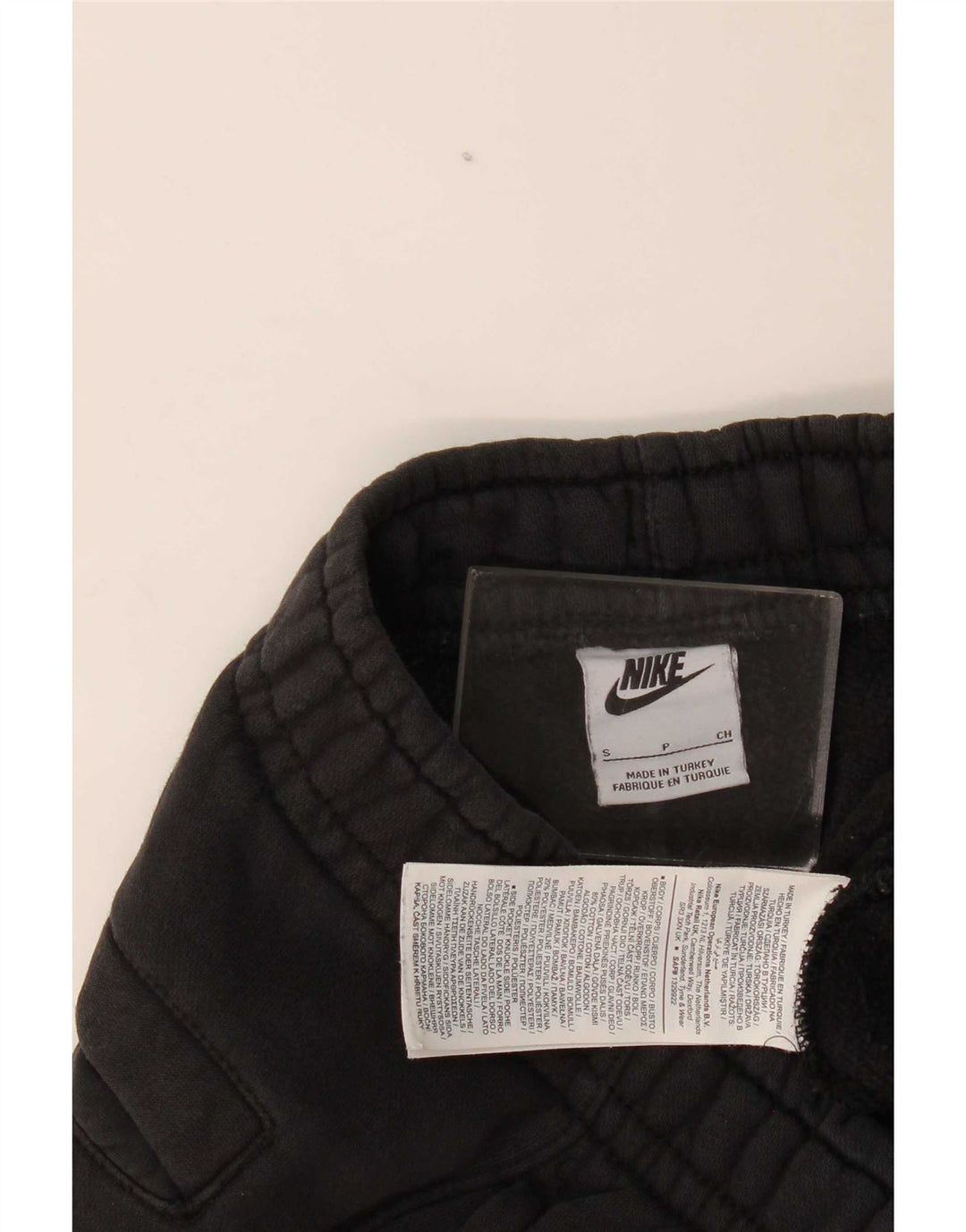 Męskie spodnie dresowe Nike z grafiką, małe, czarne, bawełniane