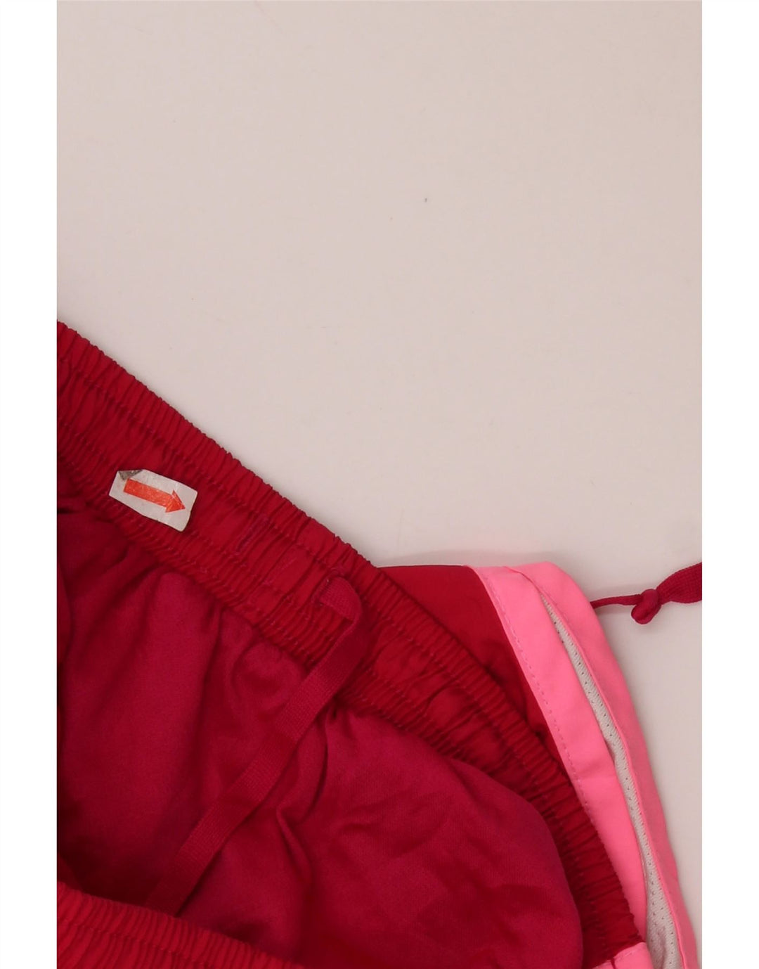 Damskie spodenki sportowe NIKE Dri Fit UK 10, małe, czerwone, z poliestru w blokach kolorów