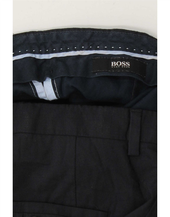 Męskie spodnie garniturowe Hugo Boss W34 L31 granatowe