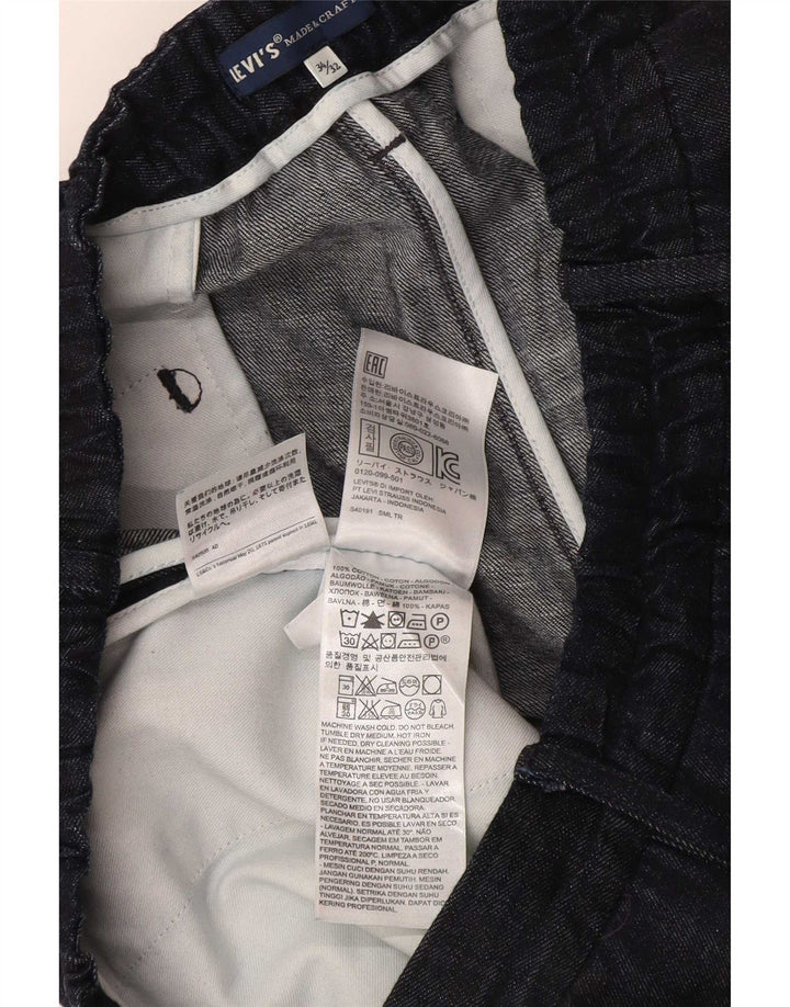 Damskie spodnie garniturowe Levi's Pegged W34 L26 Granatowa bawełna