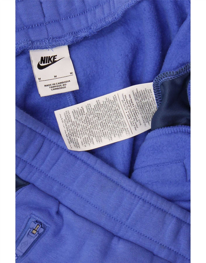 Męskie spodnie dresowe Nike, joggery, bawełna w kolorze średniego błękitu