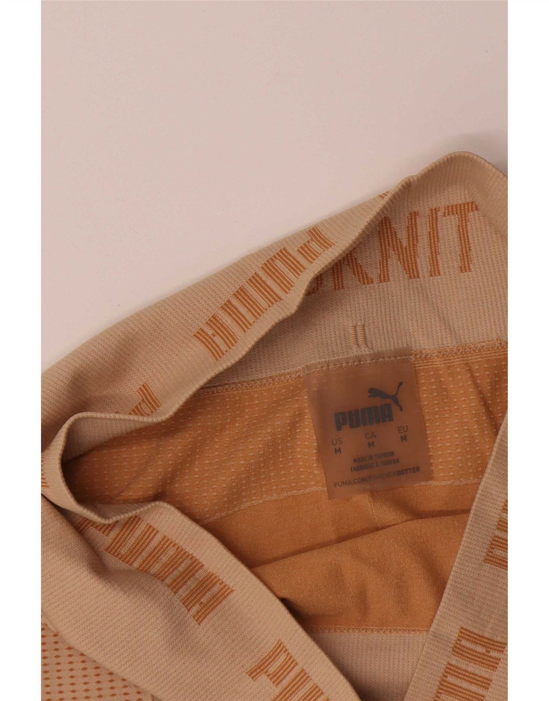 Damskie legginsy Puma Graphic UK 12 Średni Beż