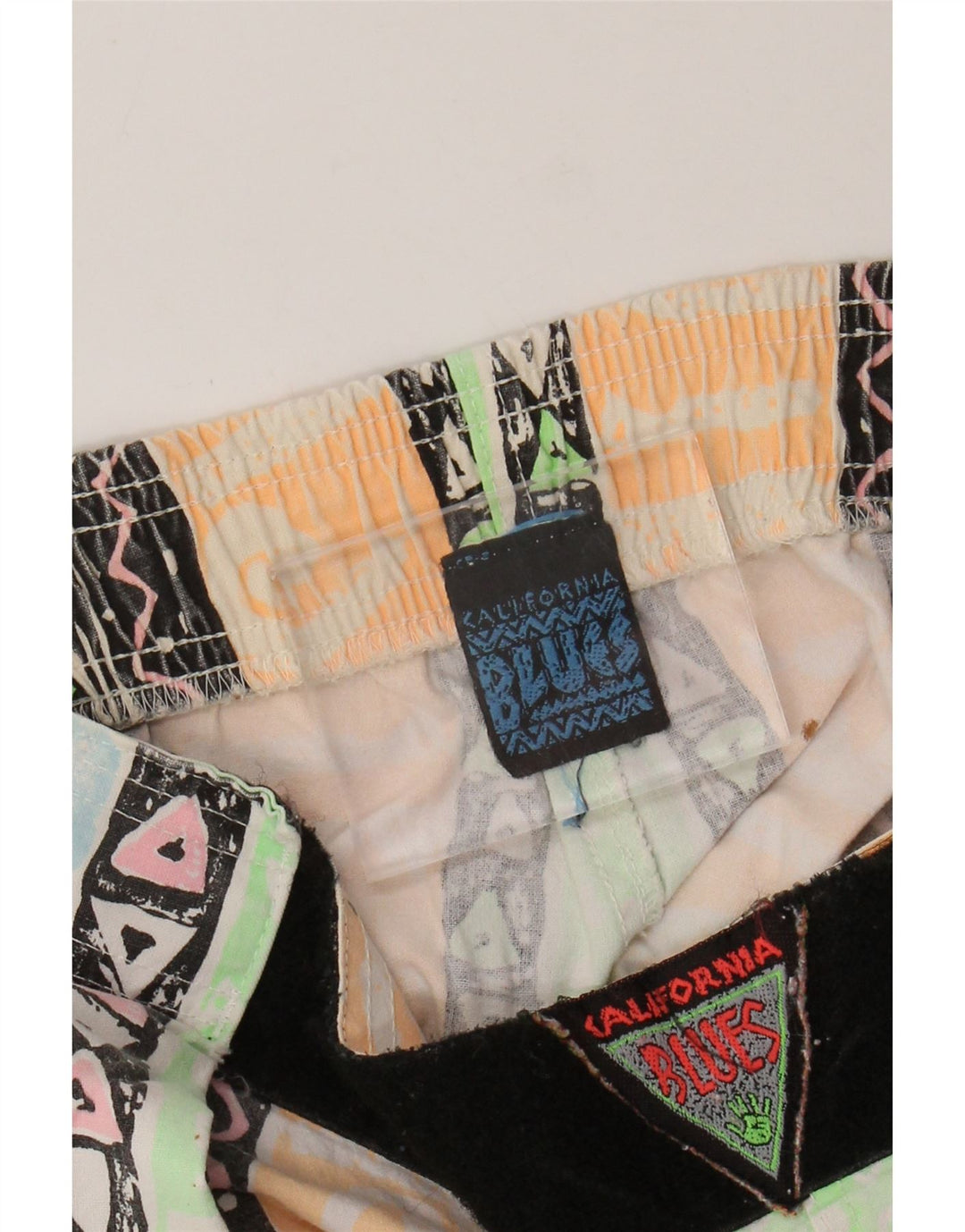 Niebieskie damskie zwężane spodnie z wysokim stanem W34 L31 Wielokolorowe geometryczne