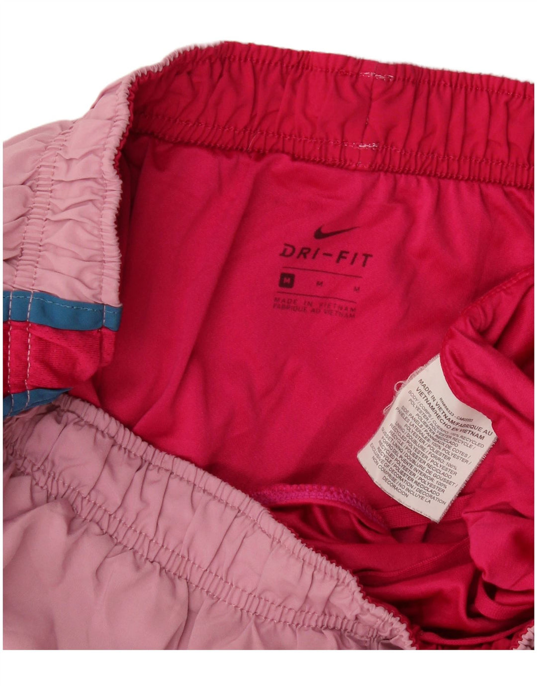 Damskie spodenki sportowe Nike Dri Fit UK 12, poliester w kolorze średniego różu