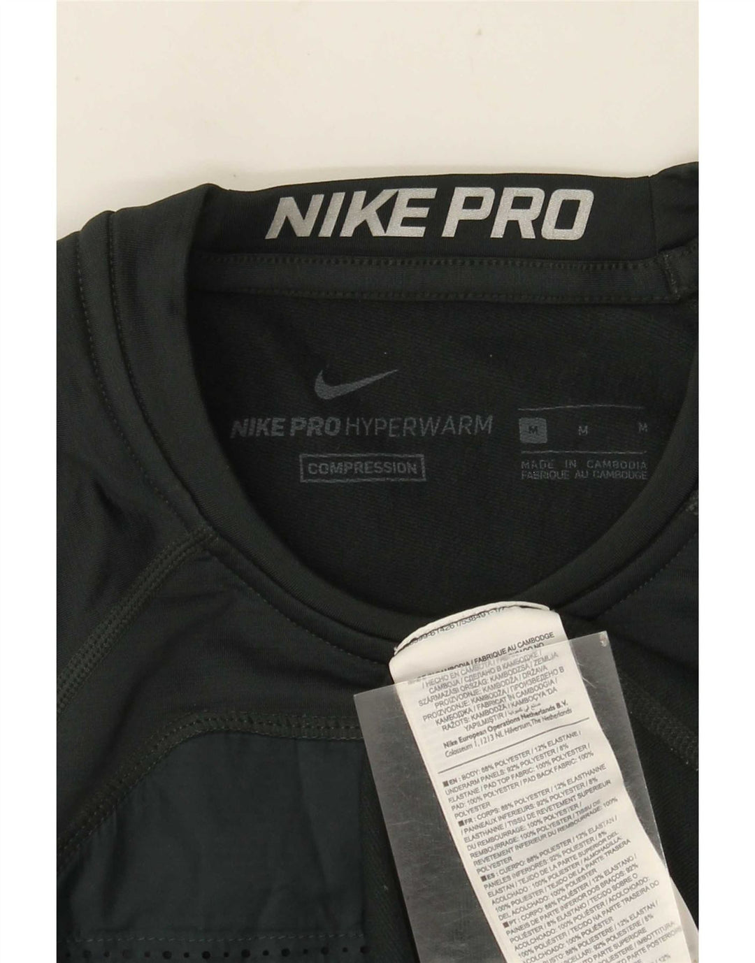 Męska koszulka graficzna Nike z długim rękawem, poliestrowa w kolorze średniej zieleni