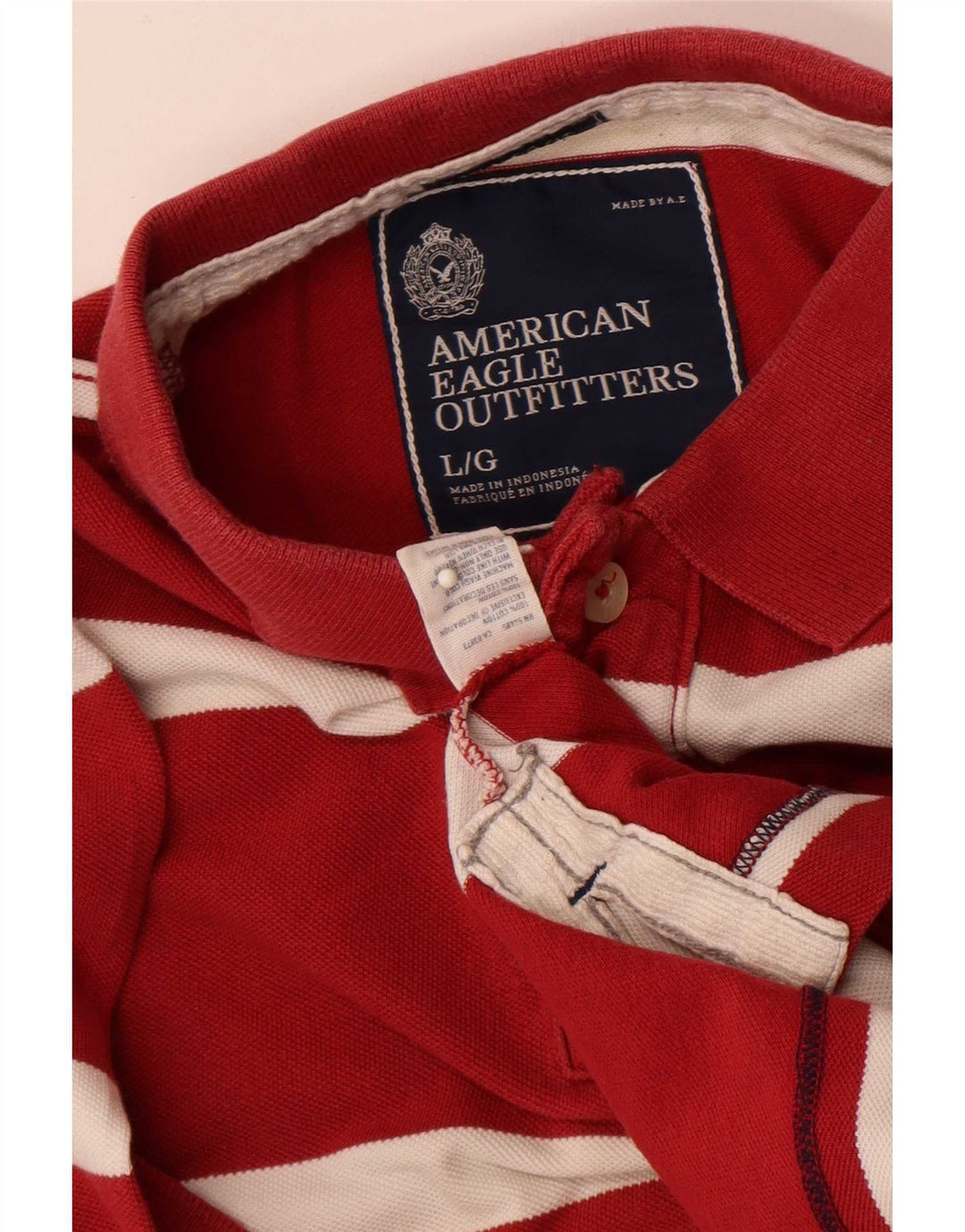 Męska koszulka polo American Eagle z krótkim rękawem i regularnym krojem, w duże czerwone paski