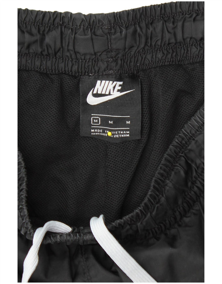 Wodoodporne spodnie damskie Nike o luźnym kroju UK 14, średni czarny nylon