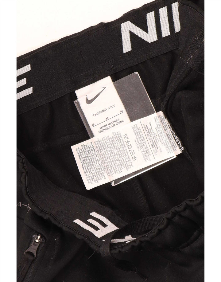 Męskie spodnie dresowe Nike Therma-Fit Joggers, średni czarny poliester