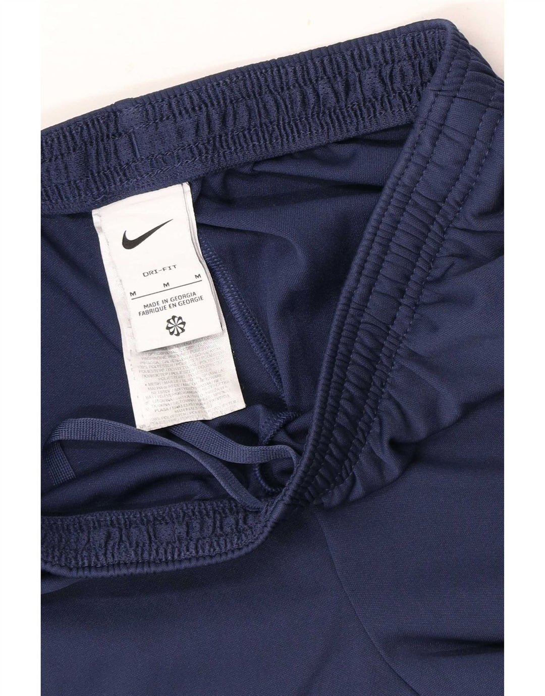 Męskie spodnie dresowe Nike Dri Fit, poliester w kolorze średniego granatu, w blokach kolorów