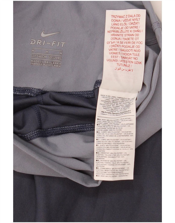 Dziewczęce legginsy Nike Dri Fit 10-11 lat, średni niebieski, poliester z blokami kolorów