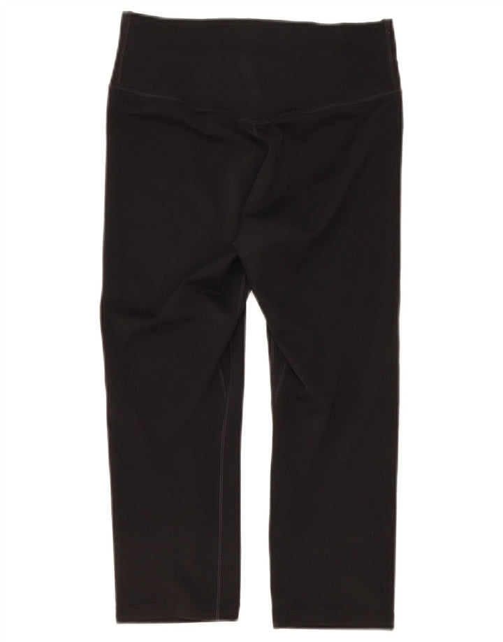 Damskie legginsy Nike Dri Fit Capri UK 6 XS, czarny poliester
