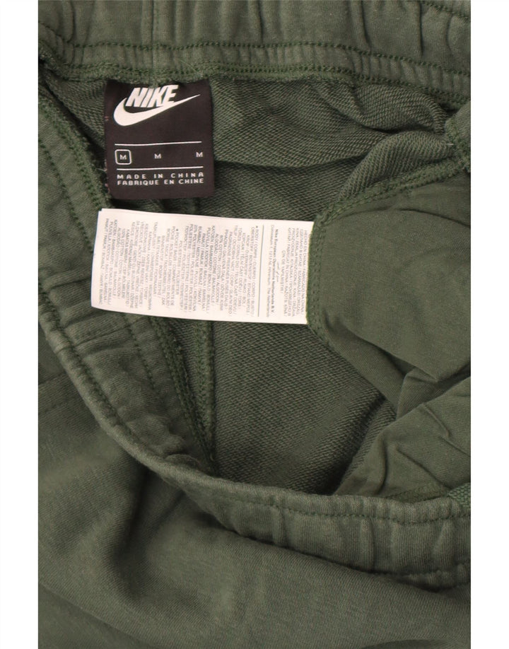 Męskie spodnie dresowe Nike Cargo Joggers, średnia zielona bawełna