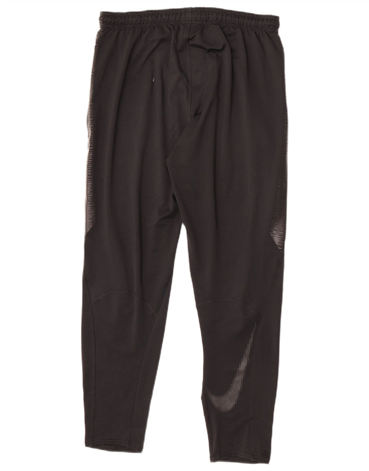Męskie spodnie dresowe Nike Dri Fit, poliester w kolorze średniej czarnej kolorystyki
