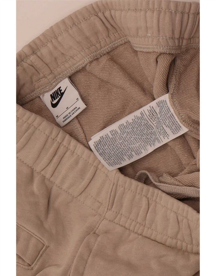 Męskie spodnie dresowe Nike w kolorze średniego beżu, bawełniane